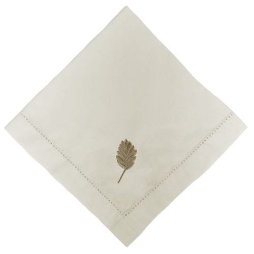 Guardanapo de algodão bege com acabamento em ponto ajour e bordado de ramo.